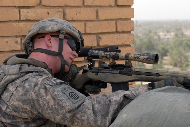 BAGHDAD - Pfc. John Motte, from Salem, Ore., a sniper with 1st Battalion, 505th Parachute Infantry Regiment, keeps a vigilant watch with his M-14 rifle. Motte and other paratroopers provide a security detail for Brig Gen. John Murray, deputy...