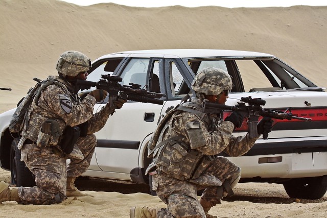 During a live fire, react to contact drill, Soldiers of Company F, 3rd Assault Helicopter Battalion, 227th Aviation Regiment, 1st Air Cavalry Brigade, 1st Cavalry Division, practice synchronized team movement and communication skills by calling...