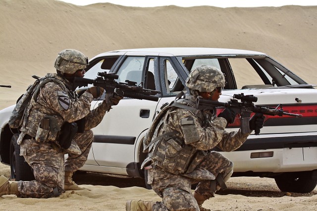 During a live fire, react to contact drill, Soldiers of Company F, 3rd Assault Helicopter Battalion, 227th Aviation Regiment, 1st Air Cavalry Brigade, 1st Cavalry Division, practice synchronized team movement and communication skills by calling out t...