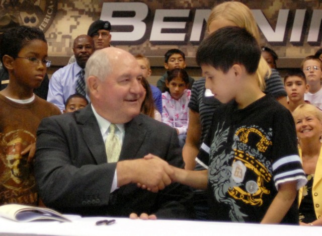 Perdue visits post, signs education bills for children