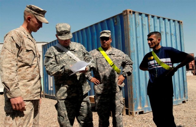 Iraqis and Marines trade welding skills