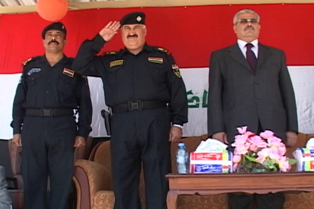 Ninewah Provincial Governor Atheel Al-Nujaifi and the Ninewah General Director of Police, Khalid Hussein Ali al-Hamdani render honors to Iraqi Police basic training graduates conducting a ceremonial pass and review during the last Iraqi Police basic ...