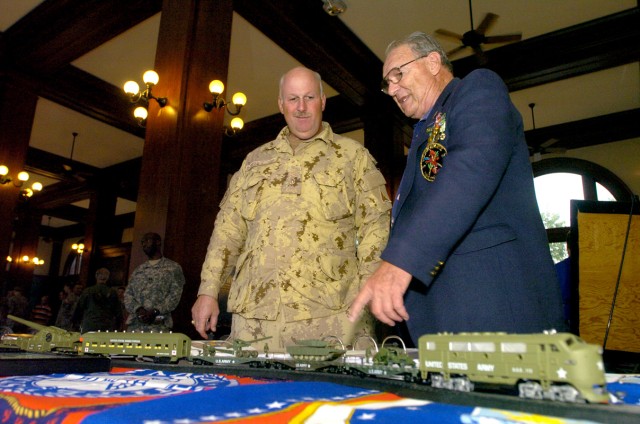 J.C. Fischer (right), curator of Hall of Heroes, shows Brig. Gen. Peter Atkinson, III Corps and Fort Hood's deputy commanding general (Canada), his display of military medals at the Temple Railroad and Heritage Museum's Military Appreciation and...