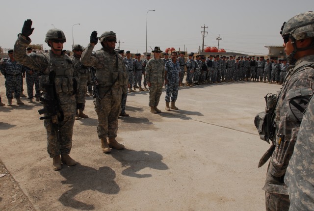 Sgt. David Crebo (left), a Farmington, N.M., native and Spc. Jonathan Real (right) , a Bayamon, Puerto Rico, native, both artillerymen with Battery B, 3rd Battalion, 82nd Field Artillery Regiment, 2nd Brigade Combat Team, 1st Cavalry Division,...