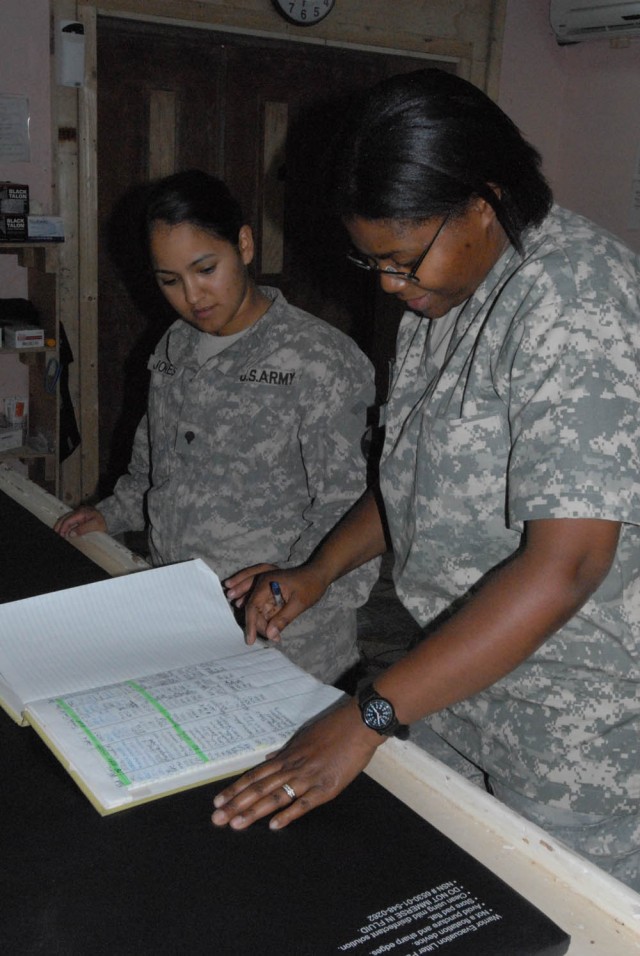 BAGHDAD - Gatesville, Texas native, Spc. Delila Jones (left), a Company C, 115th Brigade Support Battalion, 1st Brigade Combat Team, 1st Cavalry Division, speaks with Savannah, Ga. native, Capt. Patricia Hall-Stevens (right), "Iron Medic" clinical...