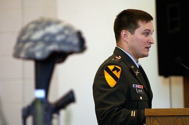 Capt. Mike Dolan, rear detachment commander of 3rd Battalion, 82nd Field Artillery Regiment, 2nd Brigade Combat Team, 1st Cavalry Division, speaks about his service with Staff Sgt. Leroy Webster, during a memorial service held for Pfc. James McCoy...