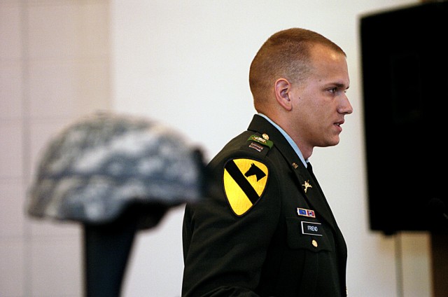Capt. Pete Friend, rear detachment commander of 1st Battalion, 8th Cavarly Regiment, 2nd Brigade Combat Team, 1st Cavalry Division, speaks about his service with Pfc. James McCoy, during a memorial service held for McCoy and Staff Sgt. Leroy...