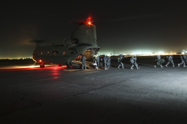 CAMP TAJI, Iraq-Under the cover of night, Soldiers from the 1st Air Cavalry Brigade, 1st Cavalry Division, Multi-National Division-Baghdad, arrive at Camp Taji, Iraq, May 20, for their year-long deployment in support of Operation Iraqi Freedom....
