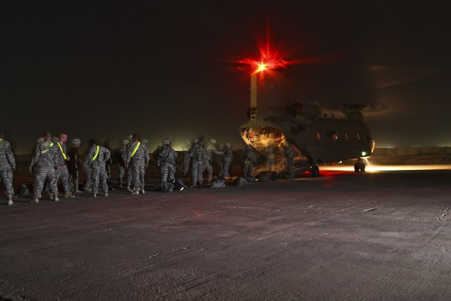 CAMP TAJI, Iraq-Under the cover of night, Soldiers from the 1st Air Cavalry Brigade, 1st Cavalry Division, Multi-National Division-Baghdad, arrive at Camp Taji, Iraq, May 20, for their year-long deployment in support of Operation Iraqi Freedom....