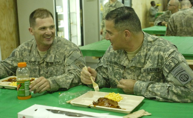 BAGHDAD - Maj. Gen. Scararrotti (right), commander of the 82nd Airborne Division, speaks with Staff Sgt. Matt Howard, of Cincinnati, Ohio, at the dining facility, May 21, at Joint Security Station Zafaraniya, located in the Karradah district of...