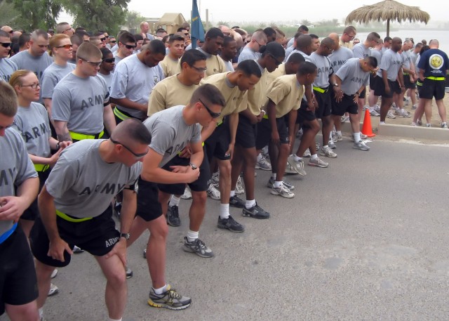 BAGHDAD - Soldiers prepare to start off the "Year of the NCO" run at Z-Lake on Victory Base Complex May 9. Soldiers from the 299th Brigade Support Battalion, 2nd Heavy Brigade Combat Team, 1st Infantry Division, Multi-National Division - Baghdad host...