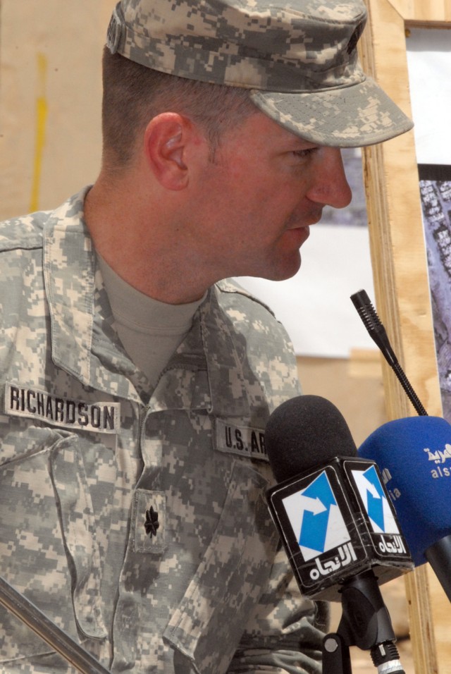 BAGHDAD - Lt. Col. John Richardson, of Tallahassee, Fla., commander of the 5th Squadron, 4th Cavalry Regiment, 2nd Brigade Combat Team, 1st Infantry Division, gives a speech during a Ghazaliyah improvement ceremony, May 20. "Today we honor the effort...