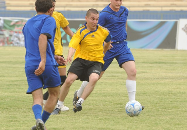 BAGHDAD - Paratroopers assigned to the 3rd Brigade Combat Team, 82nd Airborne Division, Multi-National Division-Baghdad and Iraqi Security Forces compete in a soccer match at Shaab Stadium May 22 in the Rusafa district of eastern Baghdad. The game is...