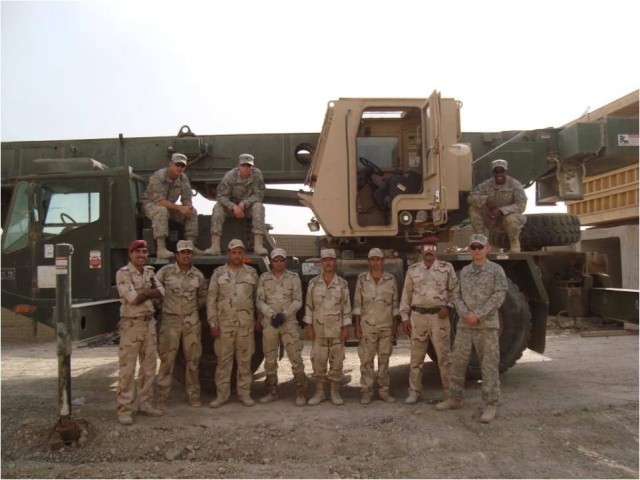BAGHDAD- Soldiers of Company A, 46th Engineer Combat Battalion (Heavy), 225th Engineer Brigade's crane training team, along with Soldiers from 17th Iraqi Army Engineer Regiment pose in front of a 22-ton crane at Joint Security Station Knight in...