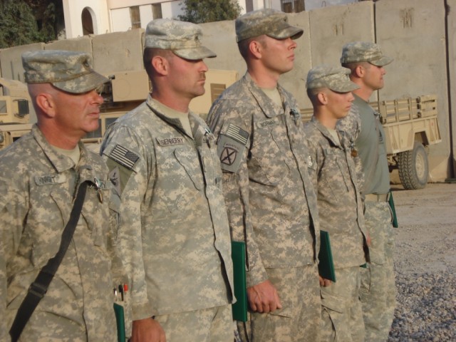 BAGHDAD- Sgt. Richard Dusenberry (2nd from left) along with his team of electricians of the 46th Engineer Combat Battalion (Heavy), 225th Engineer Brigade receive Army Commendation Medals for their work completing numerous electrical upgrades at Join...
