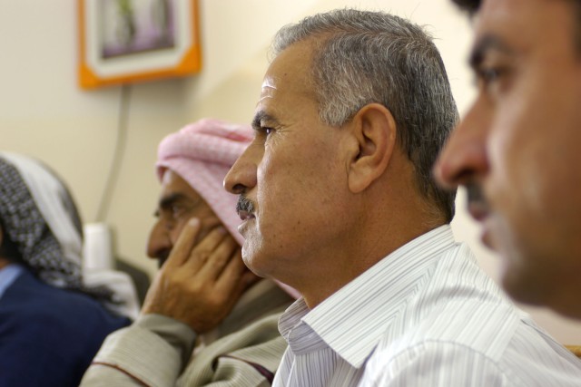 An Iraqi farmer listens intently during a small group discussion relating to the agricultural market in the Shekhan district. Farmers were given an opportunity to discuss the agriculture in their communities and address issues that, if resolved, woul...