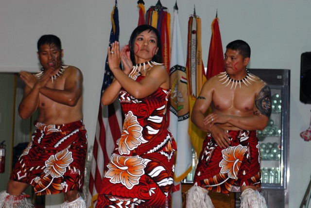 CAMP LIBERTY, Iraq -First Lt. Kimberly Osorio-Torres (center), from Honolulu, assigned to 317th Maintenance Company, 553rd Combat Sustainment Support Battalion, 10th Sustainment Brigade, performs a traditional Samoan dance at an Asian Pacific America...
