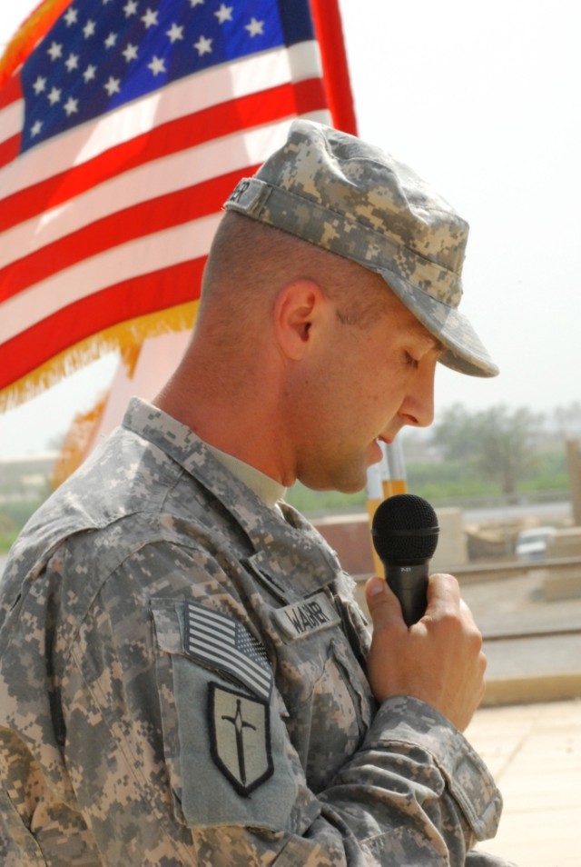 BAGHDAD - Chaplain (Capt.)  Jerry Wagner, 46th Engineer Combat Battalion (Heavy), 225th Engineer Brigade, opens the Memorial Day Service held on a rooftop on Camp Liberty, Iraq, May 25, with a prayer. The engineers observed a moment of silence for fa...