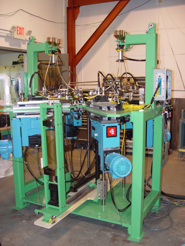 Tooele Army Depot engineers worked in conjunction with Pine Bluff Arsenal to develop an automated machine that will process 155MM artillery munitions that meets the arsenal's daily production goal of 600 canisters a day which hold an illuminating...