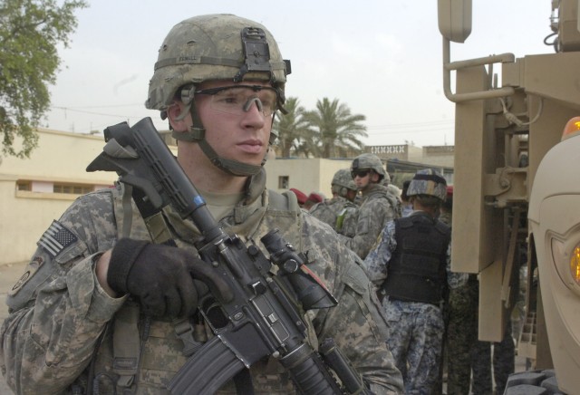 BAGHDAD - Sgt. Randy Powell, of San Rafael, Calif., assigned to the Headquarters and Headquarters Company, 2nd Battalion, 505th Parachute Infantry Regiment, 3rd Brigade Combat Team, 82nd Airborne Division, Multi-National Division-Baghdad, checks...
