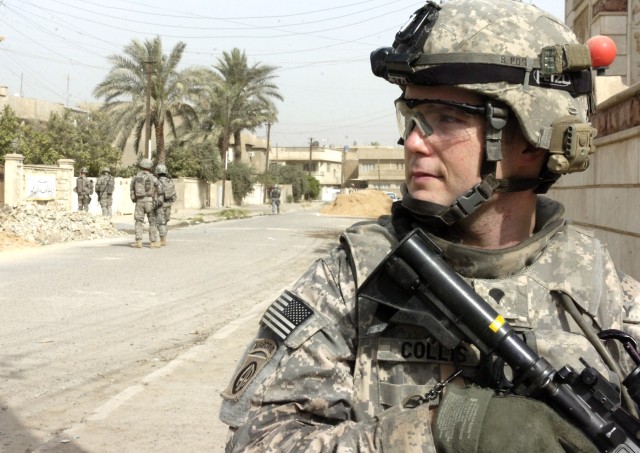 BAGHDAD - Spc. Matthew Collins, of Hinesville, Ga., assigned to the Headquarters and Headquarters Company, 2nd Battalion, 505th Parachute Infantry Regiment, 3rd Brigade Combat Team, 82nd Airborne Division, Multi-National Division-Baghdad, looks...