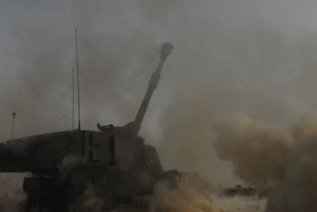 BAGHDAD - Smoke and dust mark the first Excalibur precision artillery round fired by by Soldiers of Battery A, 113th Field Artillery Battalion, 30th Heavy Brigade Combat Team, Multi-National Division-Baghdad, at Forward Operating Base Mahmudiyah, May...