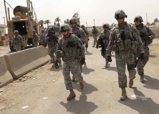 BAGHDAD - Col. Joseph Martin (right), a native of Dearborn, Mich., commander, 2nd Heavy Brigade Combat Team, 1st Infantry Division, Multi-National Division-Baghdad, walks with Lt. Gen. Charles Jacoby (left), commander, Multi-National Corps - Iraq in ...