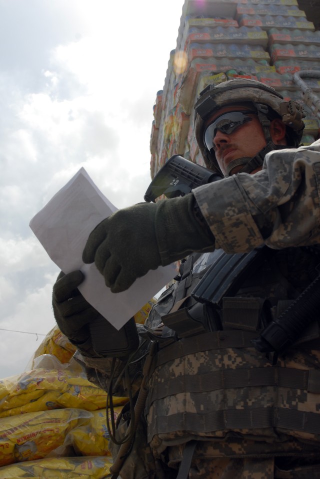BAGHDAD - Sgt. Joseph Thompson, an infantryman squad leader from Killeen, Texas, assigned to Company B, 2nd Battalion, 5th Cavalry Regiment, 1st Brigade Combat Team, 1st Cavalry Division, makes sure his squad is in the right place after looking at...