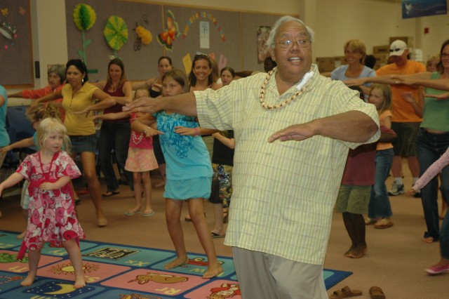 Families experience Hawaiian culture and dance at hula workshop