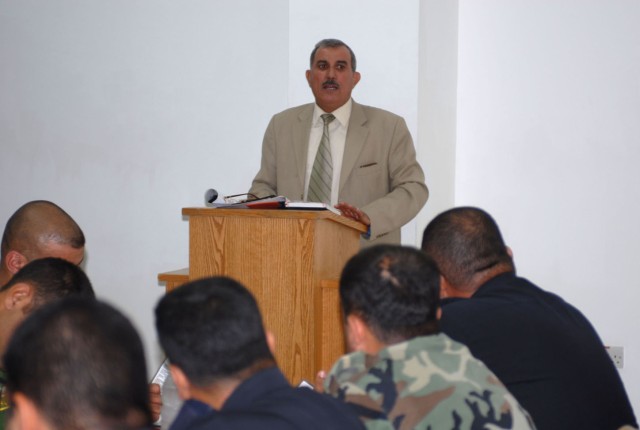 Brig. Gen. Awad, the commander of the Criminal Evidence Unit, speaks to a group of Iraqi investigators that work in and around Kirkuk city during a training meeting at Forward Operating Base Warrior's dining facility May 23. The training was aimed at...