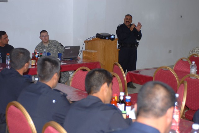 Brig. Gen. Razaq Hussein, one of the head officers at the Kirkuk police academy, speaks to a group of Iraqi Police investigators during a training meeting at Forward Operating Base Warrior's dining facility May 23. The training taught the officers ne...