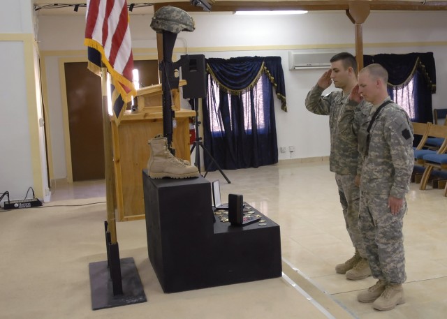 BAGHDAD -Soldiers serving with the 2nd Stryker Battalion, 112th Infantry Regiment, attached to the 2nd Heavy Brigade Combat Team, 1st Infantry Division, salute the memorial of Spc. Chad Edmundson, a native of Williamsburg, Pa., at Edmundson's Memoria...