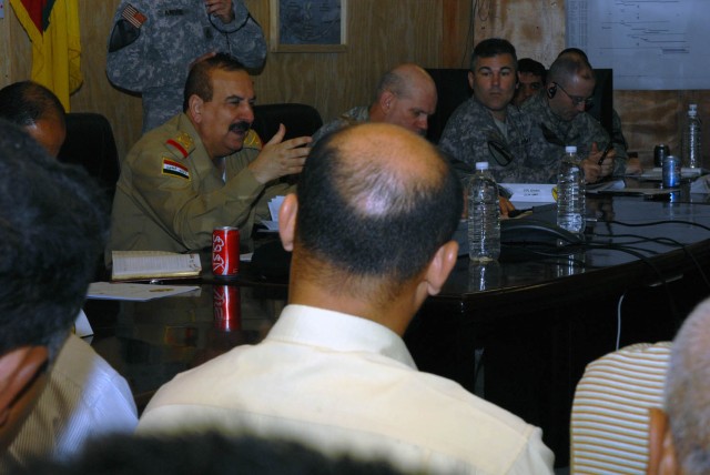 BAGHDAD - Iraqi Army Maj. Gen. Mizher (left), commander of 11th IA Division, reaffirms conference attendees that the transition of Sons of Iraq members into the Iraqi Security Forces and the civil ministries will happen in phases.  The Sons of...