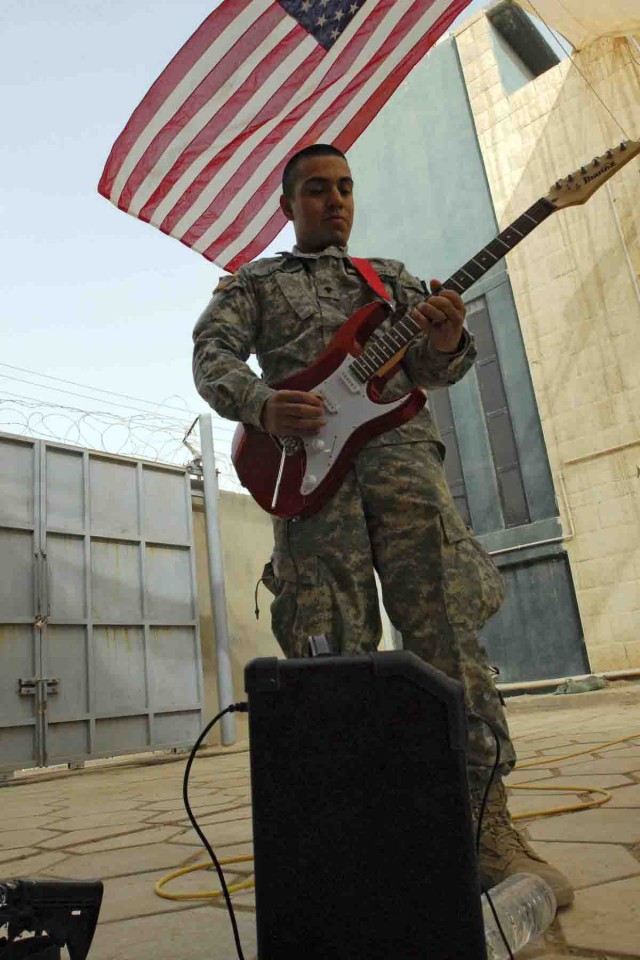 Spc. Victor Lararamirez plays his electric guitar for Sevendust, a hard rock band from Atlanta, who paid a visit to Company D, 1st Battalion, 12th Cavalry Regiment, 3rd Heavy Brigade Combat Team, 1st Cavalry Division. The Soldiers couldn't travel...