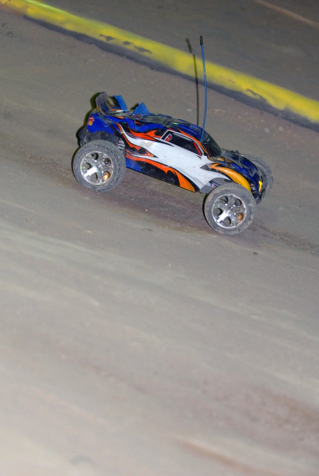BAGHDAD - A remote control car races around the dirt track located on Camp Liberty, Iraq, in a weekly competition that has been held for roughly the past four years. Soldiers, Sailors, Airman, and civilians participate in this event every week,...