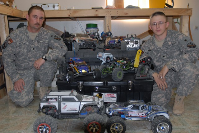 BAGHDAD - Pineville, La. Native, Spc. Krider McCan (left) and Spc. Michael Hanks, from Lecompte, La., both members of the 225th Engineer Brigade, show off their collection of remote control cars.  Their cars, which come in various shapes and...