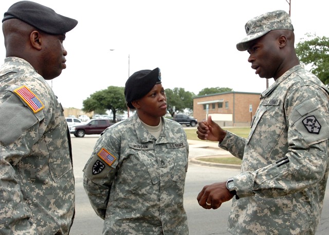 Command Sgt. Maj. Nathaniel Bartee, senior non-commissioned officer 15th Sustainment Brigade, 13th Sustainment Command (Expeditionary)(right) speaks to Sgt. 1st Class Karen Hudson and Sgt 1st Class Allen Sistrunk, Houston Army recruiters, during a...