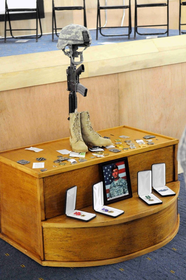 BAGHDAD - A photo of Sgt. Justin Duffy, along with his awards, decorations and several commander's coins, are displayed after the memorial ceremony in his honor, June 7, at Joint Security Station Loyalty, located in the 9 Nissan district of...