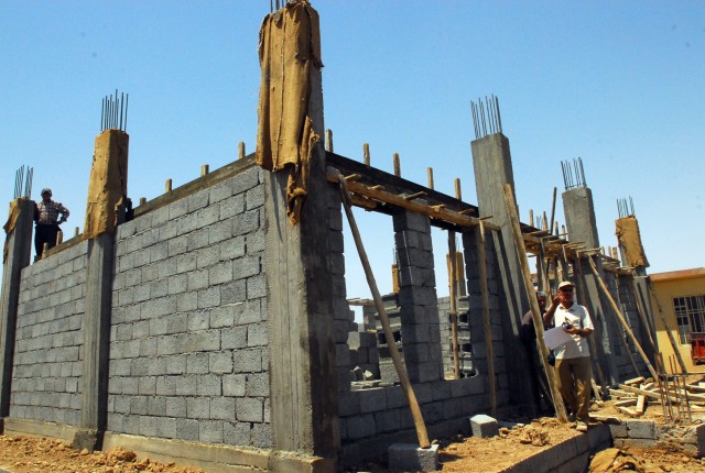The walls of a new study hall at the Laylan Roman Primary School in Laylan, Iraq, are near completion, June 4, in a new construction project between Agricultural Cooperative Development International and Volunteers in Oversees Cooperative...