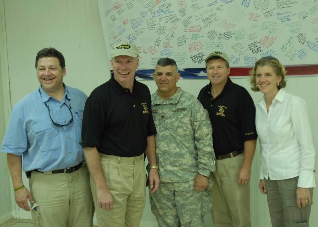 CAMP LIBERTY, Iraq - Col. Marc Ferraro (center) of Cherry Hill, N.J., 56th Stryker Brigade Combat Team commander, stands with a delegation of U.S. Congress representatives from Pennsylvania at the Command Sgt. Major Cooke Dining Hall June 7. The visi...