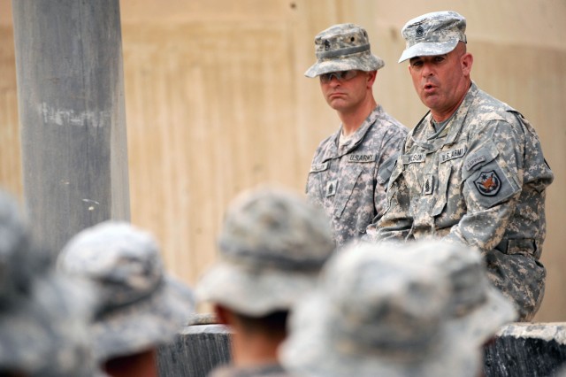 BAGHDAD - Command Sgt. Maj. Lawrence Wilson (right), top enlisted leader of the Multi-National Forces-Iraq, speaks to several Paratroopers, June 8, during his visit to Joint Security Station Loyalty, located in 9 Nissan District of eastern Baghdad. W...