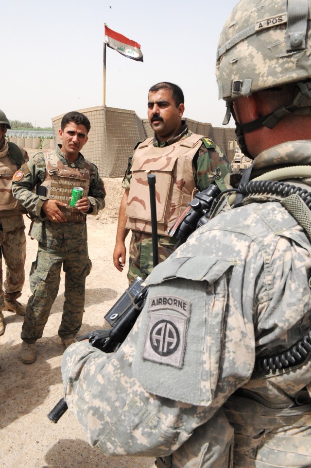 NAHIA WEHDA, Iraq - Iraqi Army Soldiers and Paratroopers assigned to Company B, 1st Battalion, 505th Parachute Infantry Regiment, 3rd Brigade Combat Team, 82nd Airborne Division, Multi-National Division-Baghdad, conduct a mission brief prior to...