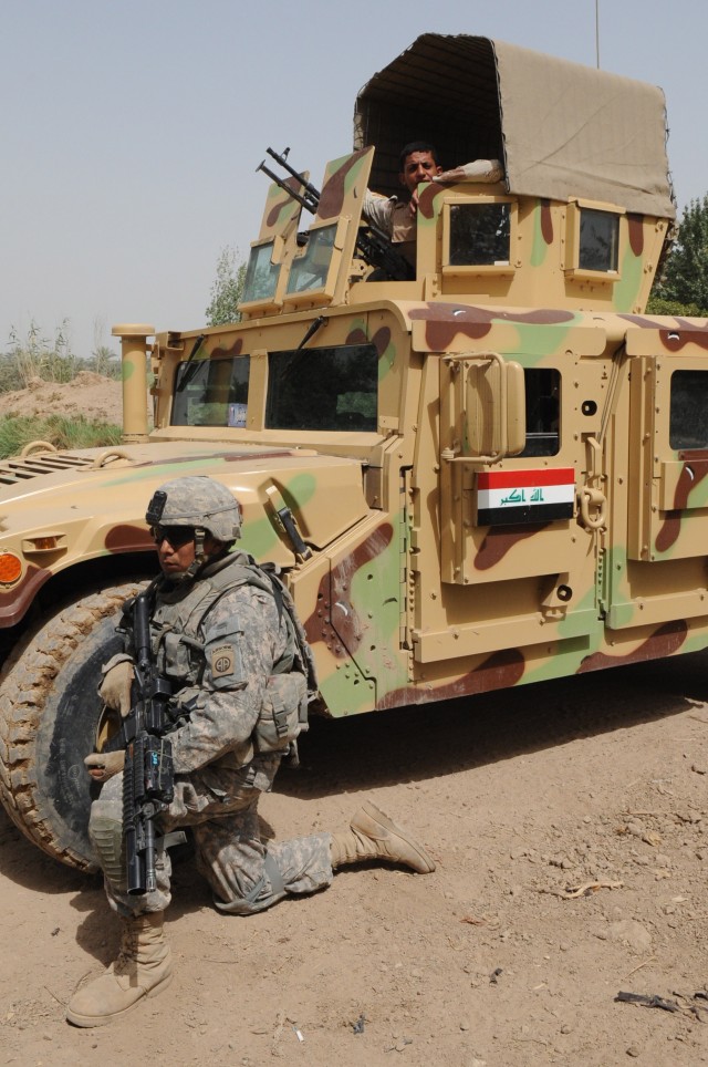 NAHIA WEHDA, Iraq - Iraqi Army Soldiers and Paratroopers assigned to Company B, 1st Battalion, 505th Parachute Infantry Regiment, 3rd Brigade Combat Team, 82nd Airborne Division, Multi-National Division-Baghdad provide security during a combined...