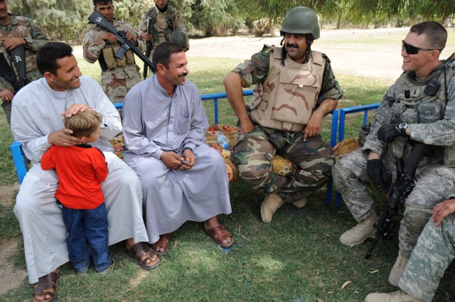 NAHIA WEHDA, Iraq - 1st Lt. Andrew Osborn (right), of Savannah, Ga., a platoon leader assigned to Company B, 1st Battalion, 505th Parachute Infantry Regiment, 3rd Brigade Combat Team, 82nd Airborne Division, Multi-National Division-Baghdad, along...