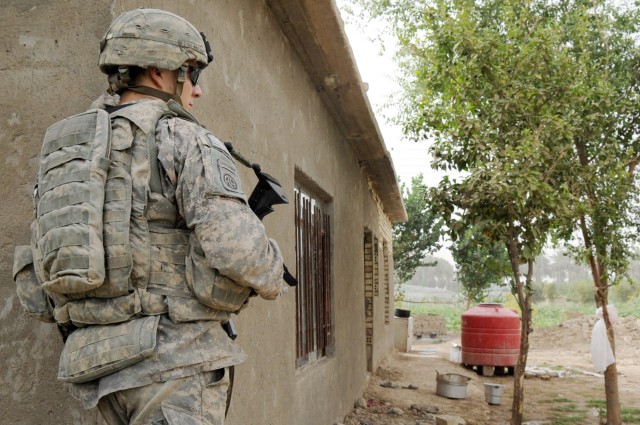 NAHIA WEHDA, Iraq - Sgt. Daniel Winstead, of Meridian, Miss., a team leader assigned to Company B, 1st Battalion, 505th Parachute Infantry Regiment, 3rd Brigade Combat Team, 82nd Airborne Division, Multi-National Division-Baghdad, checks his...