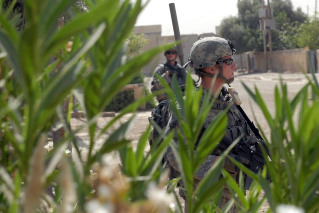 BAGHDAD - Spc. Justin Davis (foreground), an infantryman from Walkertown, N.C., and Staff Sgt. Robert Warmack (background), an infantry squad leader from Cove City, N.C., both assigned to Company A, 252nd Combined Arms Battalion, 30th Heavy...