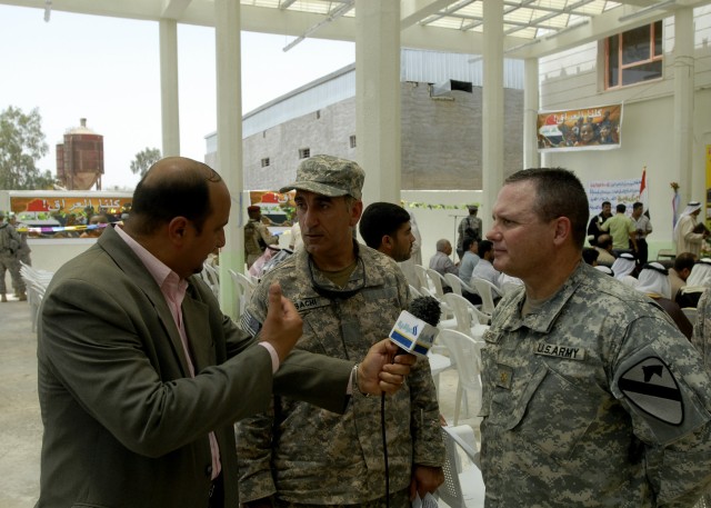 BAGHDAD - Maj. Jeffrey Schrick, a native of Frederick, Okla., commander, 2nd Battalion, 8th Cavalry Regiment, operationally attached to the 2nd Heavy Brigade Combat Team, 1st Infantry Division, Multi-National Division - Baghdad, speaks with a...