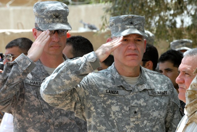 BAGHDAD -Brig. Gen. Stephen Lanza, deputy chief of staff for strategic affairs, Multi-National Force-Iraq, and Col. Joseph Martin a Dearborn, Mich., native and commander of the 2nd Brigade Combat Team, 1st Infantry Division render a hand salute...