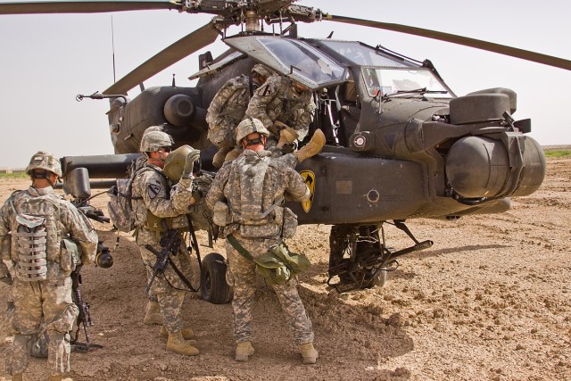 TAJI, Iraq - Soldiers of Company F, 3rd Battalion, 1st Air Cavalry Brigade, 1st Cavalry Division, Multi-National Division - Baghdad, remove the crew members from an AH-64D Apache attack helicopter during a downed aircraft training exercise at Camp Ta...