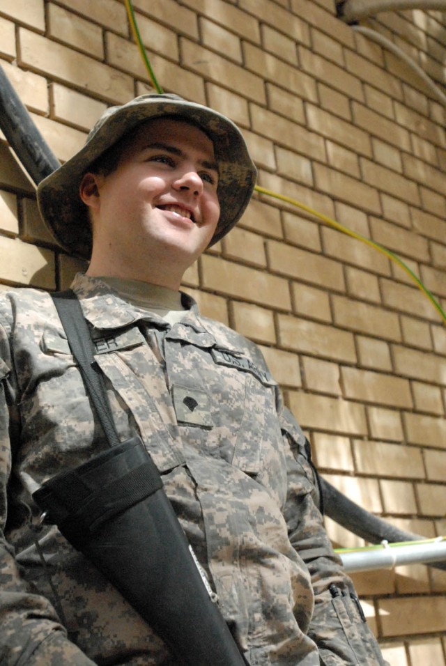 BAGHDAD - Coshocton, Ohio native, Spc. Robert Rizer enjoys a break away from the Command Information Center (CIC) at Joint Security Station War Eagle, north of Baghdad, June 11. Rizer is a Radio and Telephone Operator (RTO) for Headquarters and...